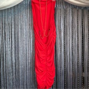 Red tightly fitting dress, with chain straps